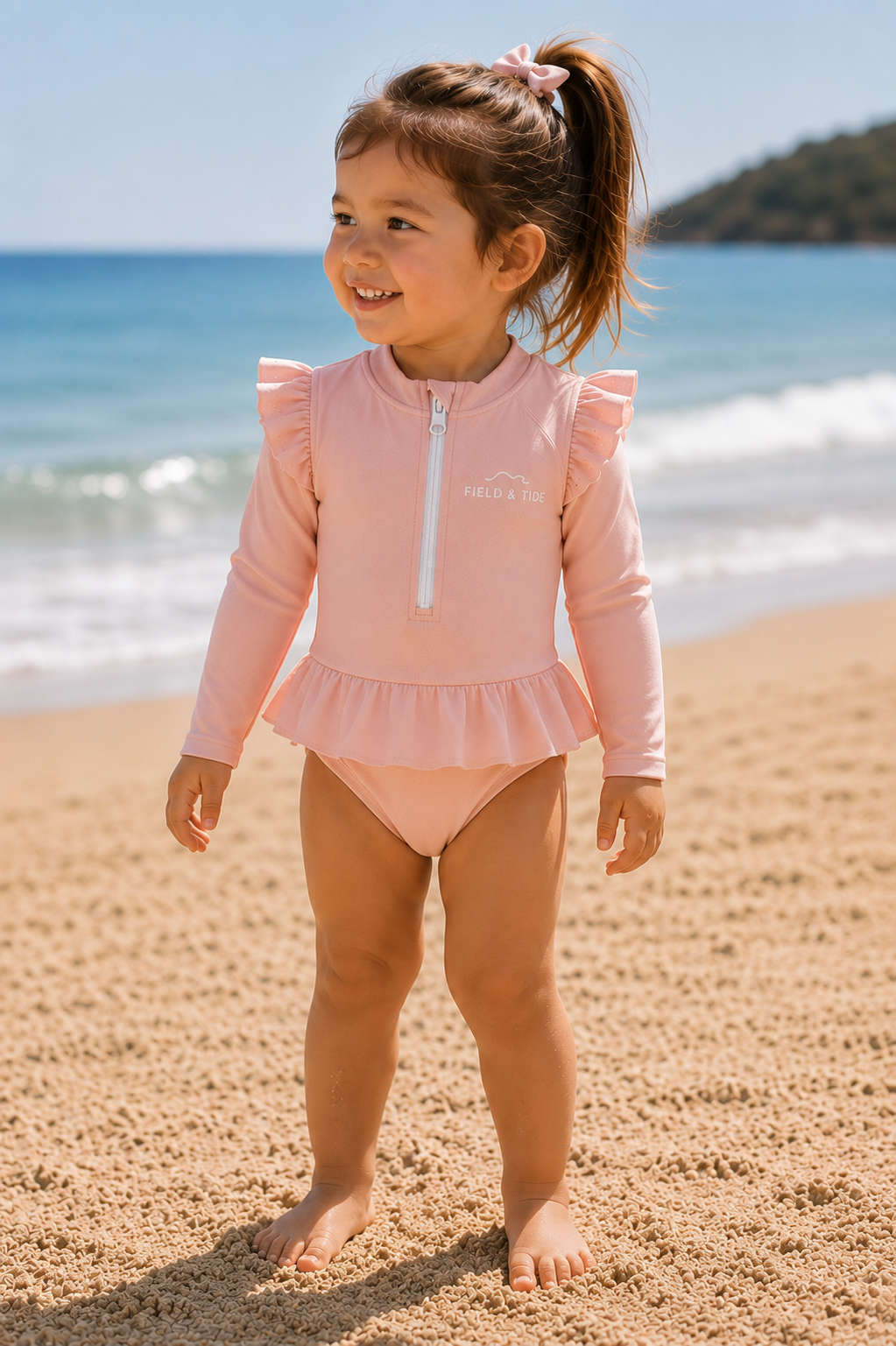 A soft-focus glimpse of a child at the beach